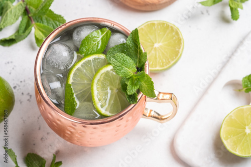 Canvas Print Moscow mule alcoholic cocktail in copper mug with lime, mint and cucumber