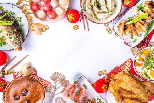 Wallpaper Mural Traditional Chinese lunar New Year dinner table, party invitation, menu background with pork, fried fish, chicken, rice balls, dumplings, fortune cookie, nian gao cake, noodles, chinese decorations Torontodigital.ca
