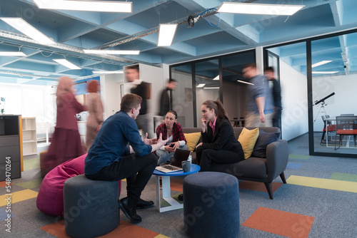 Bilde på lerret Multiethnic startup business team on meeting in a modern bright open space coworking office