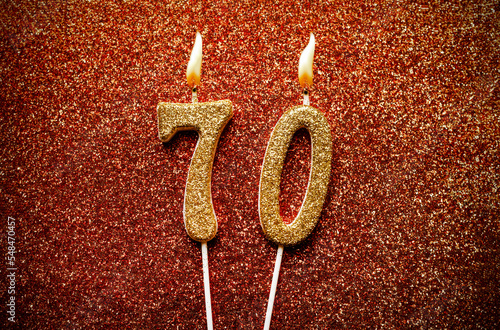 Photography Number 70 seventy candle on glitter background