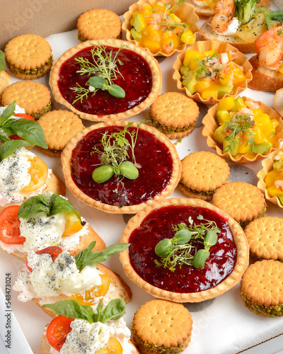 assorted snacks for catering in a cardboard box