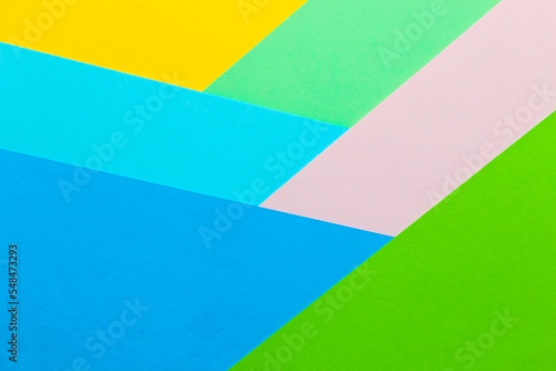 Multicolored geometric background from paper cardboard abstraction.
