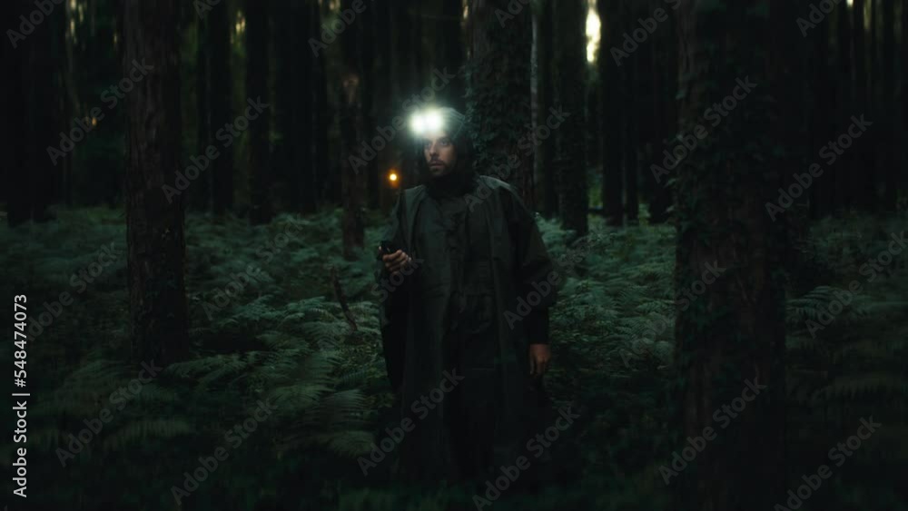 Explorer lost in the middle of the forest does not find the way back at night Explorer lost in the middle of the forest does not find the way back at night