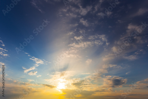 dramatic sunset on blue cloudy sky background