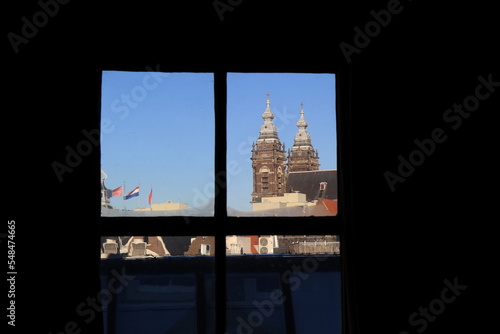 View from the Ons' Lieve Heer op Solder Church with Sint-Nicolaas Kerk Church Towers in Amsterdam, Netherlands photo