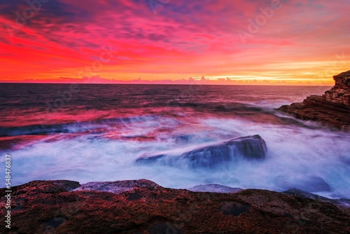 Blazing red sunrise over the Sydney east coast © Diaconescu