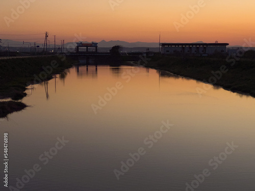 Irrigation canal reflecting the sunset