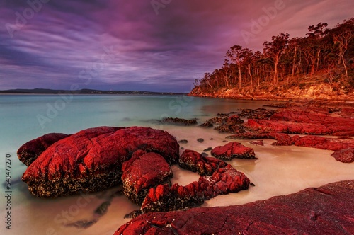 Sunset sky highlighting the red rocks and blue water of Eden photo