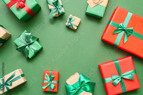 Frame made of Christmas gift boxes on green background © Pixel-Shot