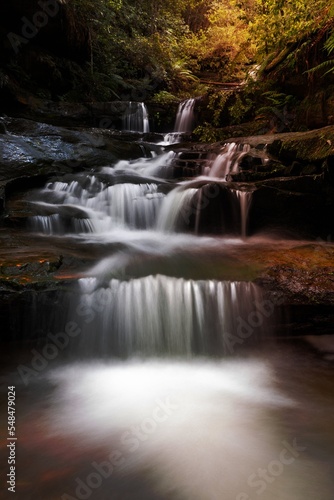 Cascading water through gully into little rock pool