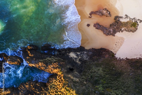 Beach, water tunnel and secret window high in the cliff