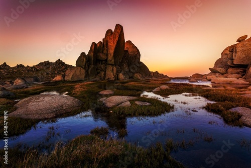 Rocky Tor in Snowy Mountains surrounded by blue pools
