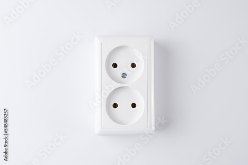 White double socket isolated on white background. Electric lighting concept