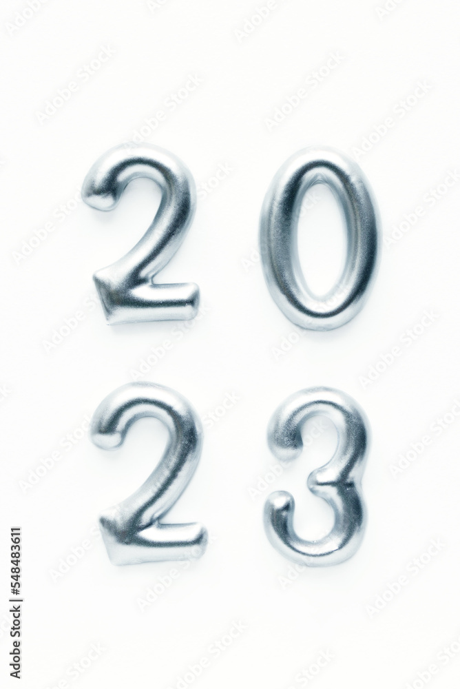 Silvery decorative numbers of the new year 2023 on a white background. Christmas card, holiday decor Silvery decorative numbers of the new year 2023 on a white background. Christmas card, holiday decor