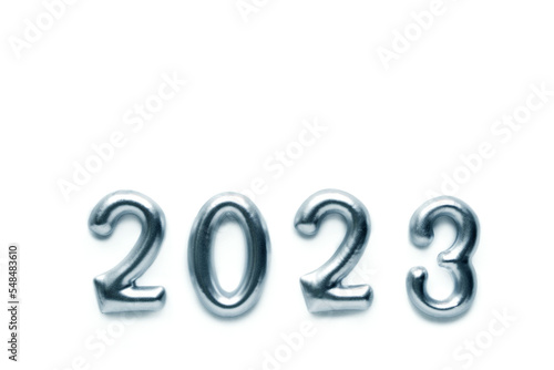 Silvery decorative numbers of the new year 2023 on a white background. Christmas card, holiday decor