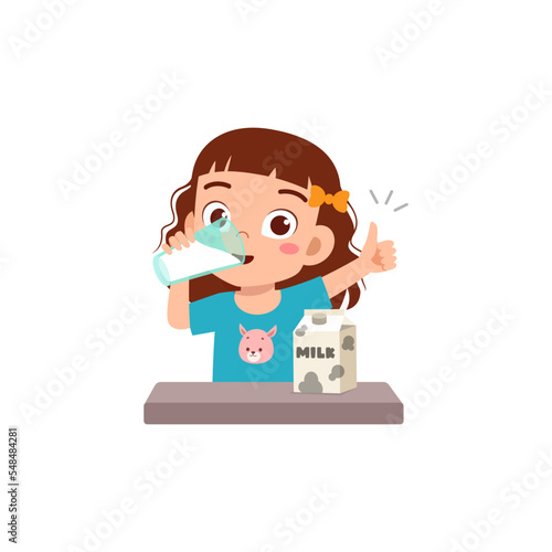 little kid hold and drink a glass of fresh milk