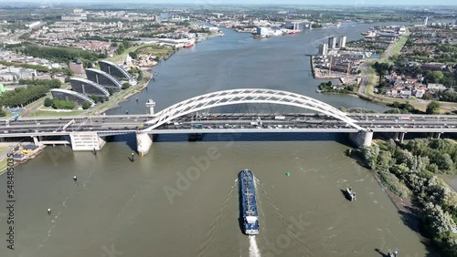 The Van Brienenoordbrug arch bridge over the Nieuwe Maas in Rotterdam IJsselmonde and Kralingen-Crooswijk on the east side of Rotterdam , in the Dutch province of South Holland. Aerial photo