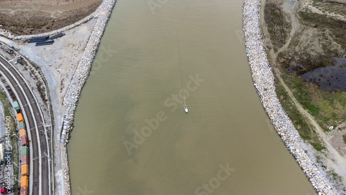 Aerial view of a little boat in the cenger of the river, Tuscany, Italy photo