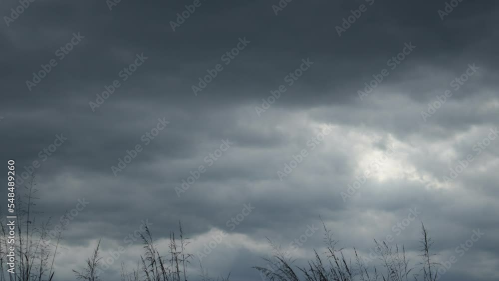 formation of gray rain clouds with the wind after white clouds darkening before the storm formation of gray rain clouds with the wind after white clouds darkening before the storm
