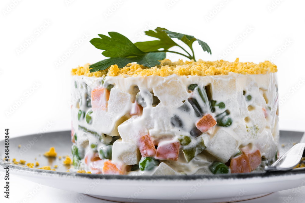 Russian salad or Olivier salad for Christmas dinner isolated on white background Russian salad or Olivier salad for Christmas dinner isolated on white background