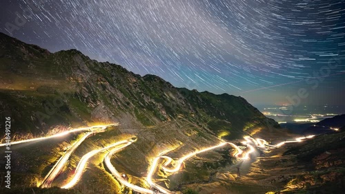 Amazing time lapse of star trails in the night sky over famous Transfagarasan mountain road in Romania.