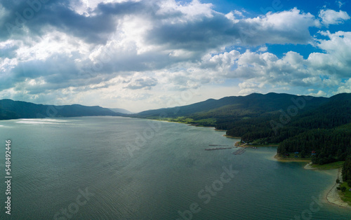 Breeding of freshwater fish in lake with round nets. Rhodope mountains, Europe. Panorama, top view