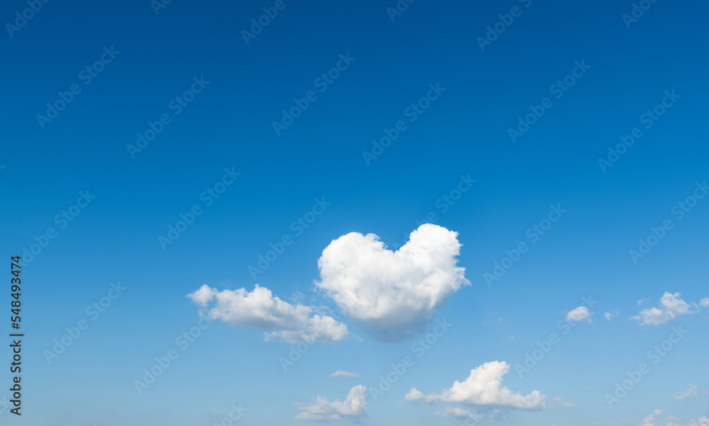 White heart shaped cloud in the blue sky White heart shaped cloud in the blue sky