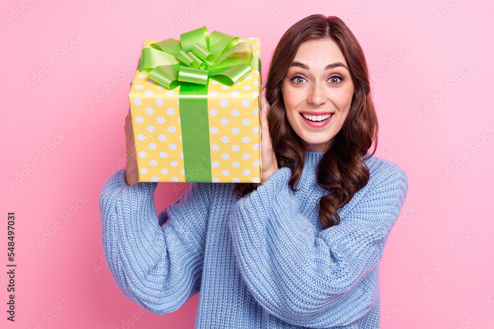 Portrait of funny cheerful girl hands hold receive giftbox toothy smile isolated on pink color background Portrait of funny cheerful girl hands hold receive giftbox toothy smile isolated on pink color background
