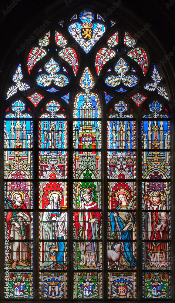 BRUSSELS - JUNE 22: Saints from windowpane in gothic church Notre Dame du Sablon on June 22, 2012 in Brussels.