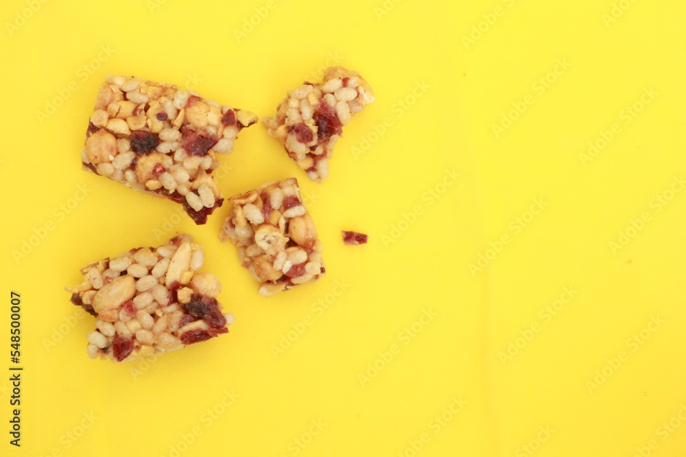 Almond and oat protein bars on yellow background Almond and oat protein bars on yellow background