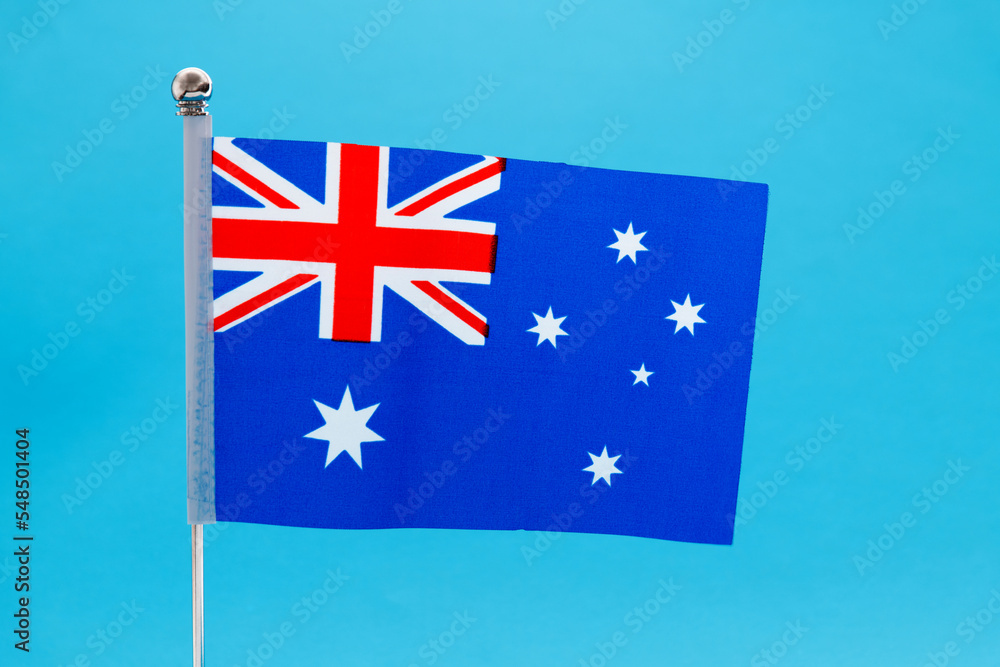 Fototapeta premium Australian national flag waving on blue background