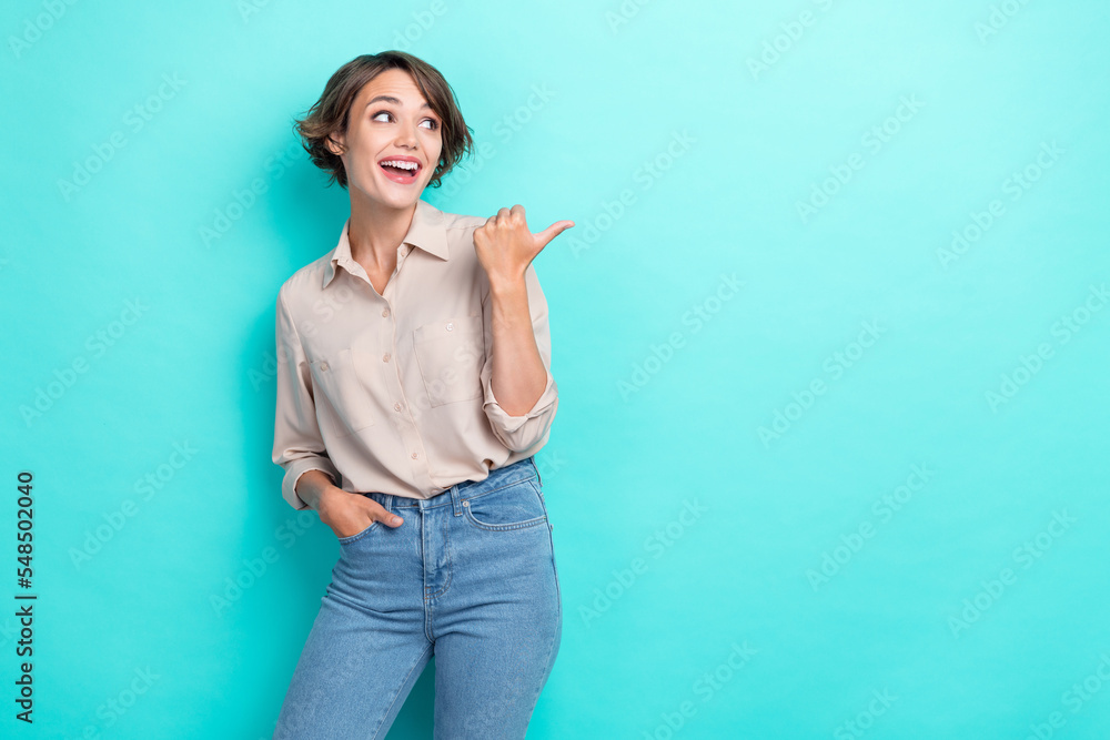 Photo of young gorgeous nice pretty businesswoman looking interested excited finger directing offer empty space isolated on cyan color background Photo of young gorgeous nice pretty businesswoman looking interested excited finger directing offer empty space isolated on cyan color background