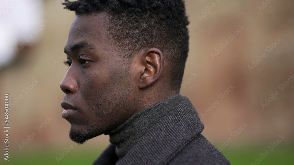 Thoughtful black African man portrait face close-up, tracking shot