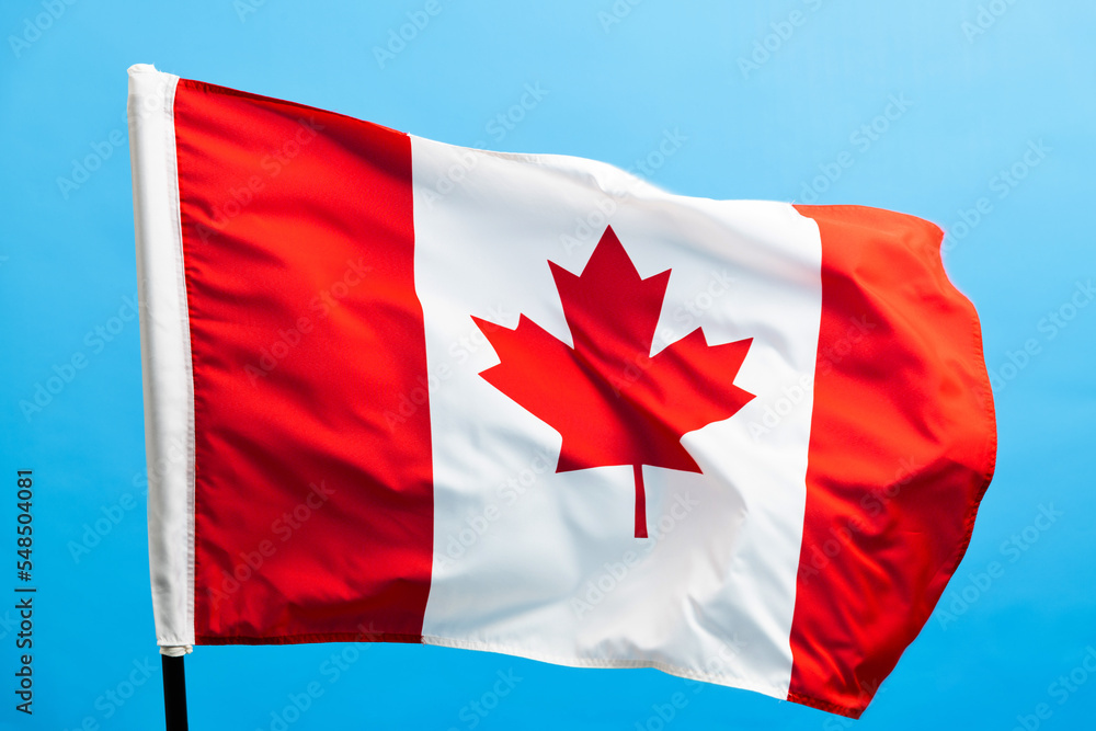 Canada flag waving on blue background Canada flag waving on blue background