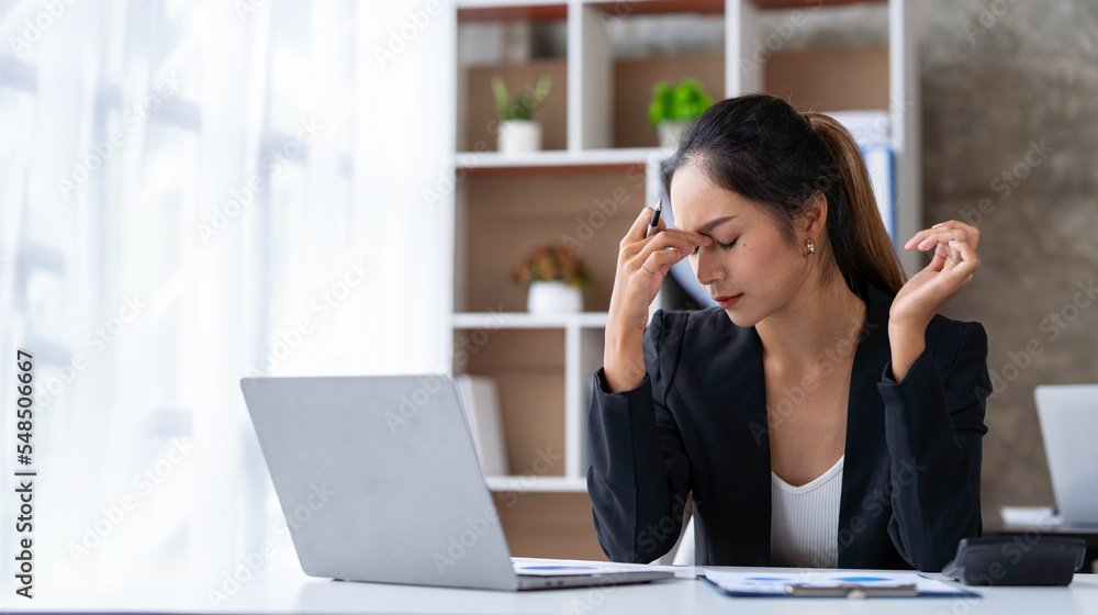 tired business woman sleepy and bored from sitting at a desk for a long time and has office syndrome tired business woman sleepy and bored from sitting at a desk for a long time and has office syndrome