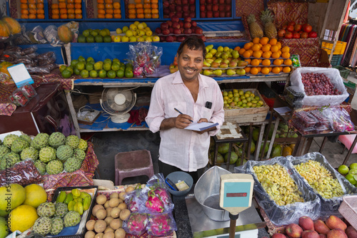 Fruit vendour Selling Fruits at the Market photo