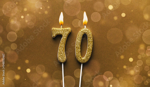 Number 70 seventy candle on bokeh background