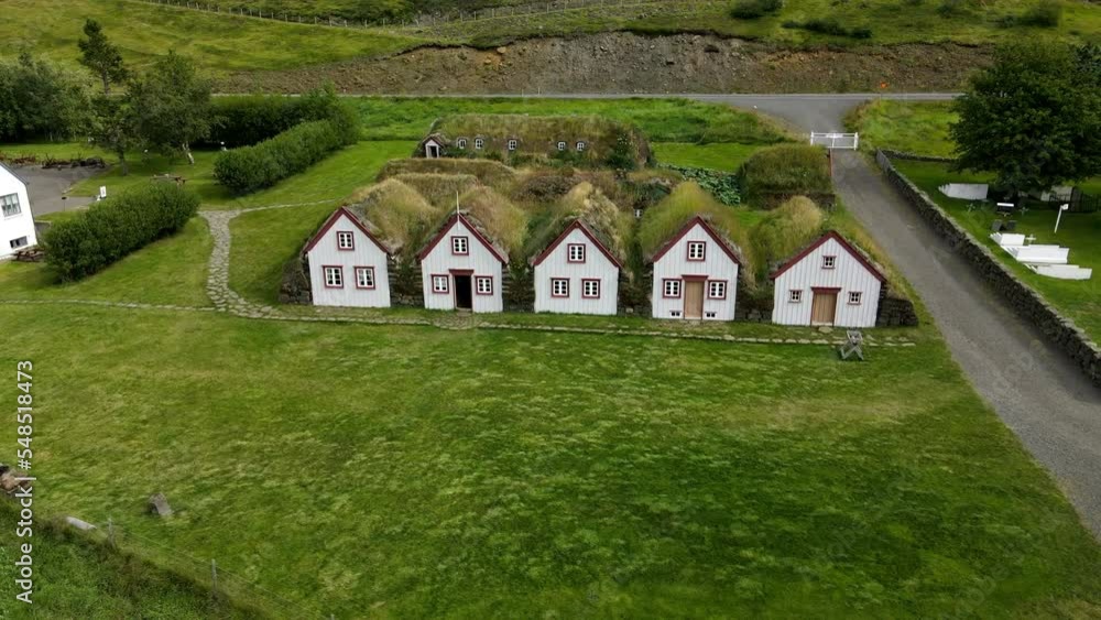 Aerial close circular shot of the famous turf houses of Iceland Aerial close circular shot of the famous turf houses of Iceland