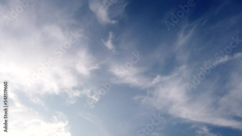 White fluffy and beautiful cumulus clouds like a cotton  freedom smooth tranform like angel wings shape on blue sky  in daytime beauty in  nature top view tropical  time lapse