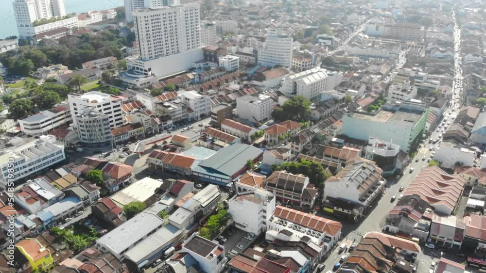 Aerial view of houses and a busy road with moving cars Aerial view of houses and a busy road with moving cars
