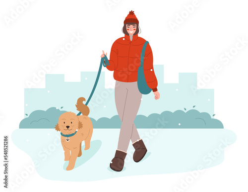 Young woman walking with dog. Pet owner strolling with his dog on leash. Walk Your Dog Month concept. 