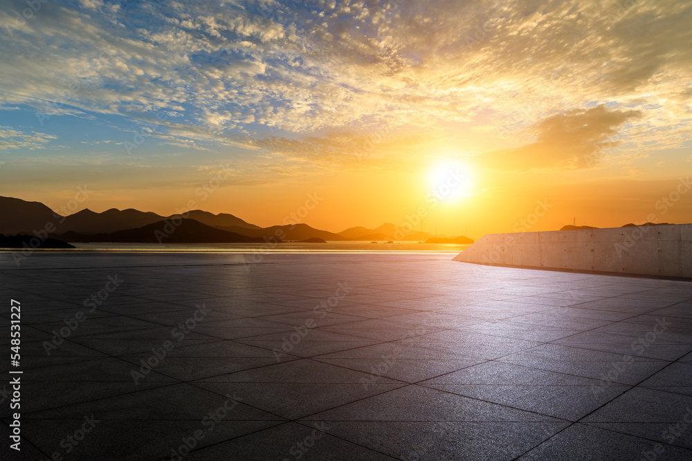 Empty square floor and sea with mountain nature landscape at sunrise 