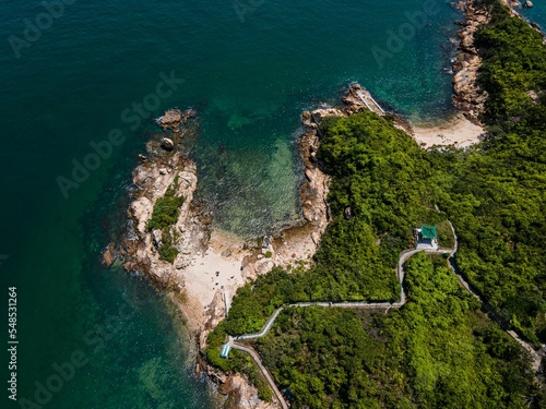 Quadro su tela Aerial shot of a Peng Chau beach surrounded by green trees in Hong Kong