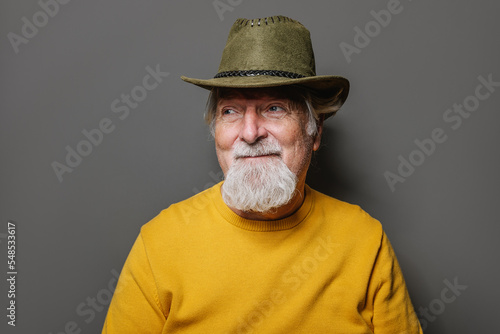 Bearded senior man in cowboy hat photo
