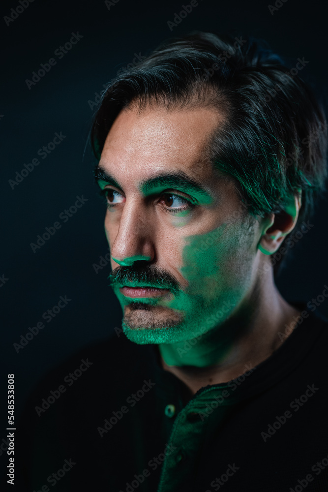 Serious man with mustache on black background Serious man with mustache on black background