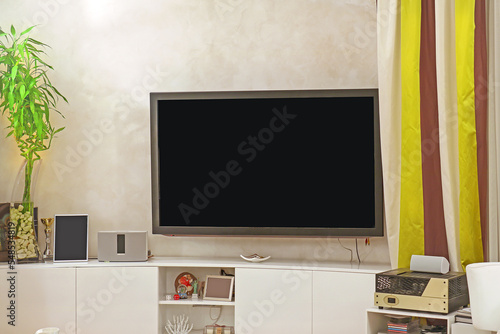 Large TV screen inside living room interior