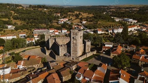 Aerial view of a sunlit Sabugal castle clear sky background photo