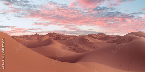 Beautiful sand dunes in the Sahara desert with amazing sunrise sky - Sahara, Morocco
