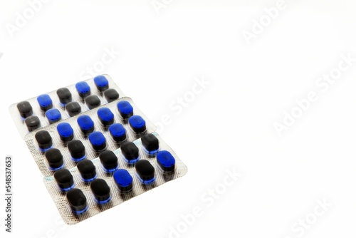 Tablet pills isolated on a white background in inverted color