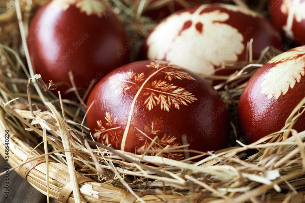 Easter eggs dyed with onion skins in a wicker basket Easter eggs dyed with onion skins in a wicker basket